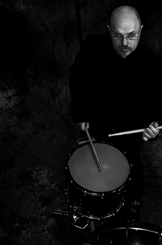 Edward Freytag posing while playing a snare drum